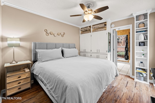 3325 Tekoa Mountain Way, Sevierville, TN 37876 - bedroom featuring ornamental molding, wood finished floors, and ceiling fan