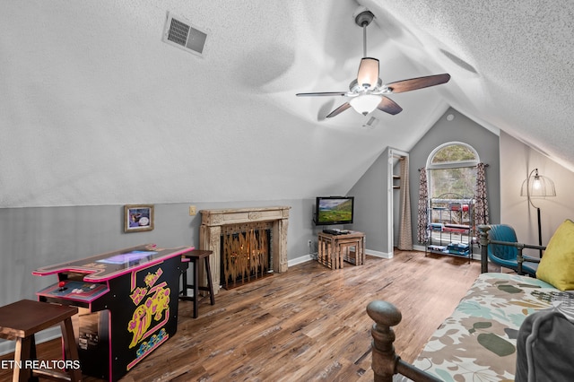3325 Tekoa Mountain Way, Sevierville, TN 37876 - living room featuring a textured ceiling, wood finished floors, ceiling fan, vaulted ceiling, and baseboards