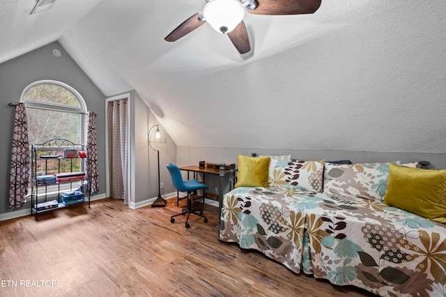 3325 Tekoa Mountain Way, Sevierville, TN 37876 - bedroom with wood finished floors, lofted ceiling, a textured ceiling, baseboards, and ceiling fan