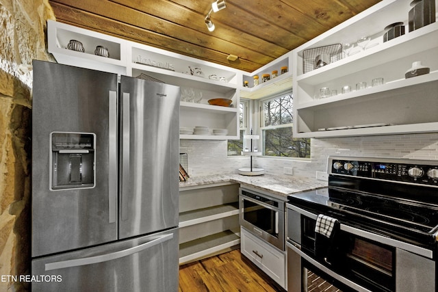 3325 Tekoa Mountain Way, Sevierville, TN 37876 - kitchen with appliances with stainless steel finishes, open shelves, tasteful backsplash, light stone counters, and dark wood finished floors