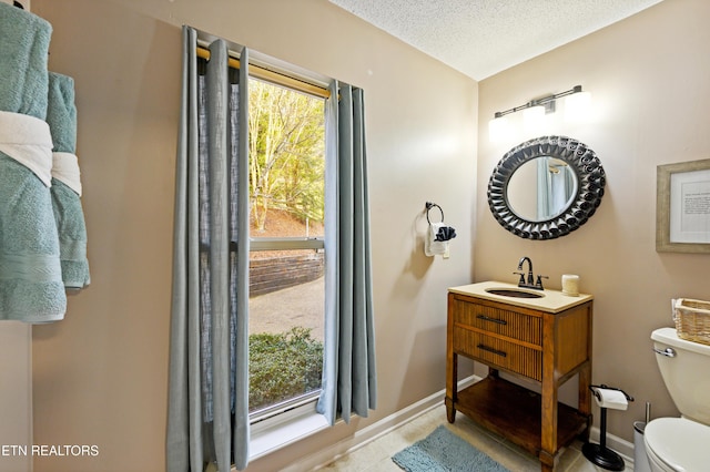 3325 Tekoa Mountain Way, Sevierville, TN 37876 - bathroom with toilet, tile patterned flooring, baseboards, a textured ceiling, and vanity
