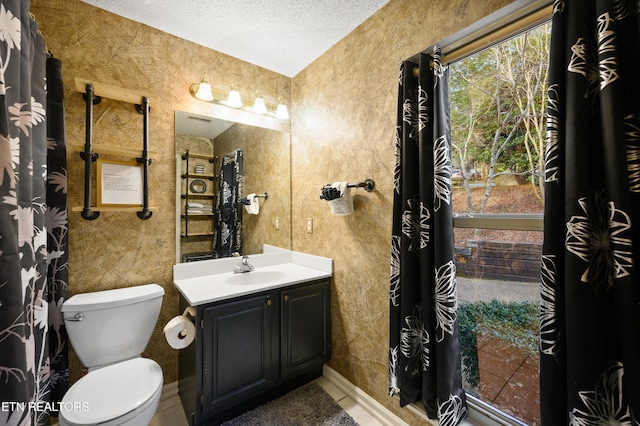 3325 Tekoa Mountain Way, Sevierville, TN 37876 - full bathroom featuring vanity, a textured ceiling, and toilet