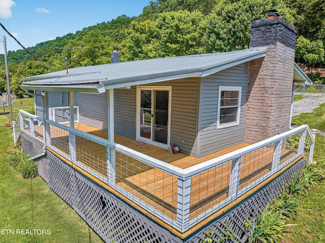 2594 Indian Creek Rd, Thorn Hill, TN 37881 - back of property featuring a chimney, a forest view, and a metal roof