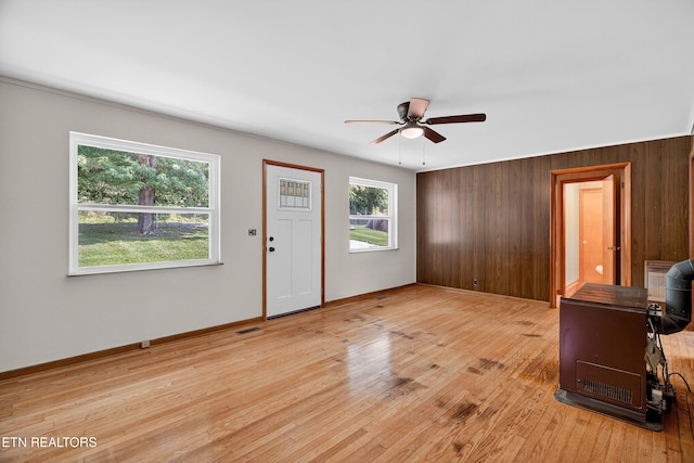 2594 Indian Creek Rd, Thorn Hill, TN 37881 - entryway featuring ceiling fan, light wood finished floors, and wooden walls