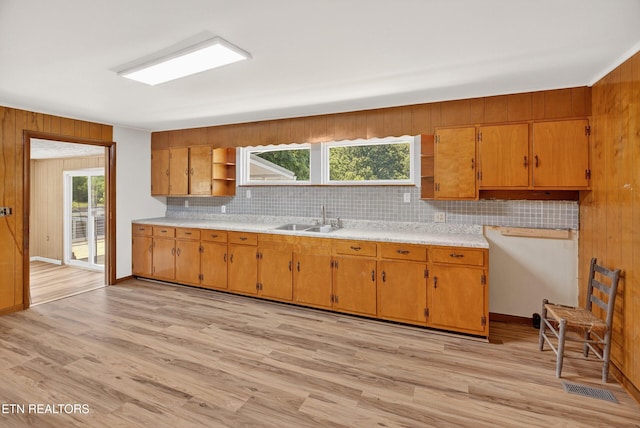 2594 Indian Creek Rd, Thorn Hill, TN 37881 - kitchen with open shelves, decorative backsplash, light countertops, light wood finished floors, and wood walls