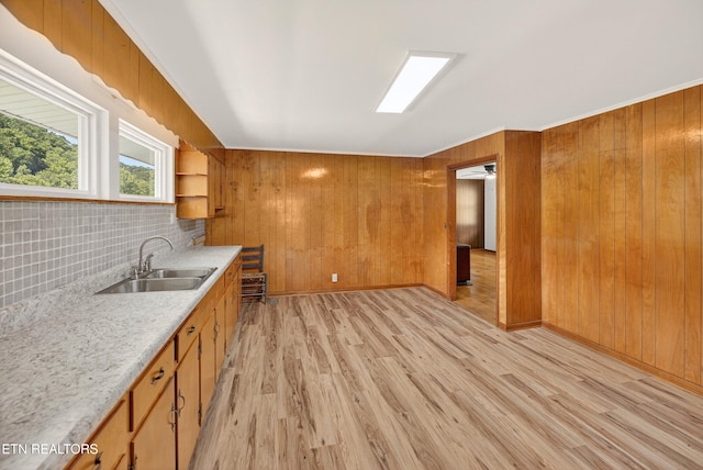 2594 Indian Creek Rd, Thorn Hill, TN 37881 - kitchen with light countertops, open shelves, light wood-type flooring, brown cabinetry, and tasteful backsplash