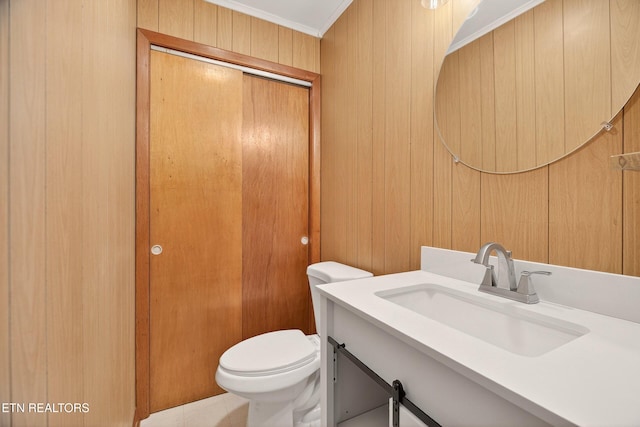 2594 Indian Creek Rd, Thorn Hill, TN 37881 - half bathroom featuring vanity, ornamental molding, and wooden walls