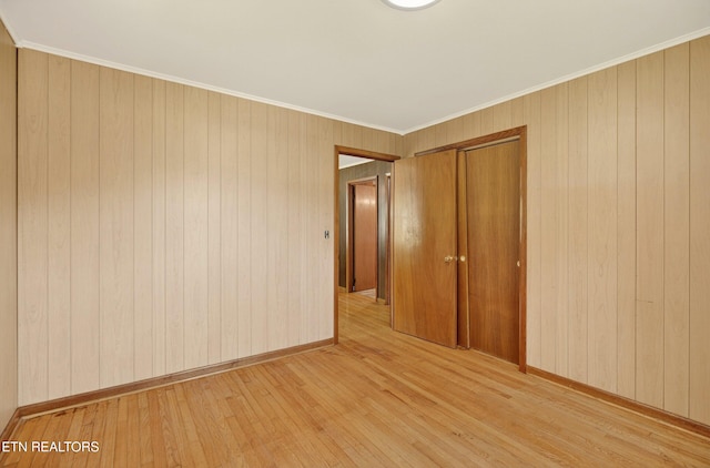 2594 Indian Creek Rd, Thorn Hill, TN 37881 - unfurnished room featuring light wood-style floors, wood walls, and crown molding
