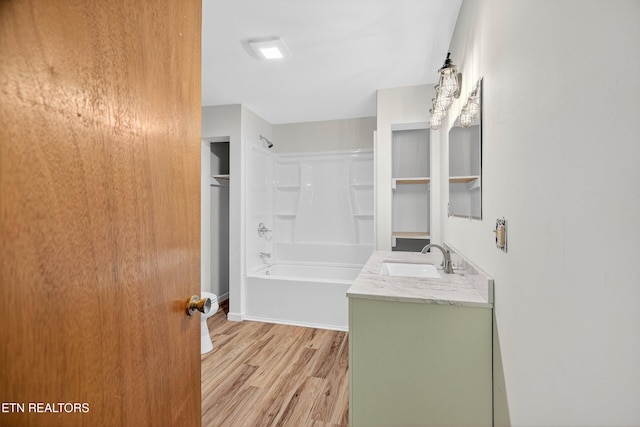2594 Indian Creek Rd, Thorn Hill, TN 37881 - full bathroom featuring wood finished floors, vanity, and tub / shower combination