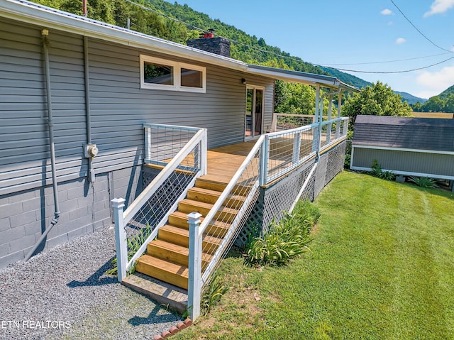 2594 Indian Creek Rd, Thorn Hill, TN 37881 - deck with a yard, a mountain view, and a storage shed