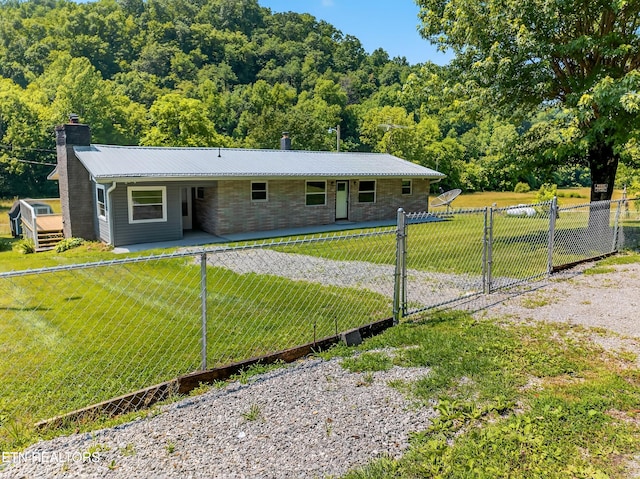 2594 Indian Creek Rd, Thorn Hill, TN 37881 - ranch-style house featuring a chimney, a metal roof, stone siding, and a wooded view