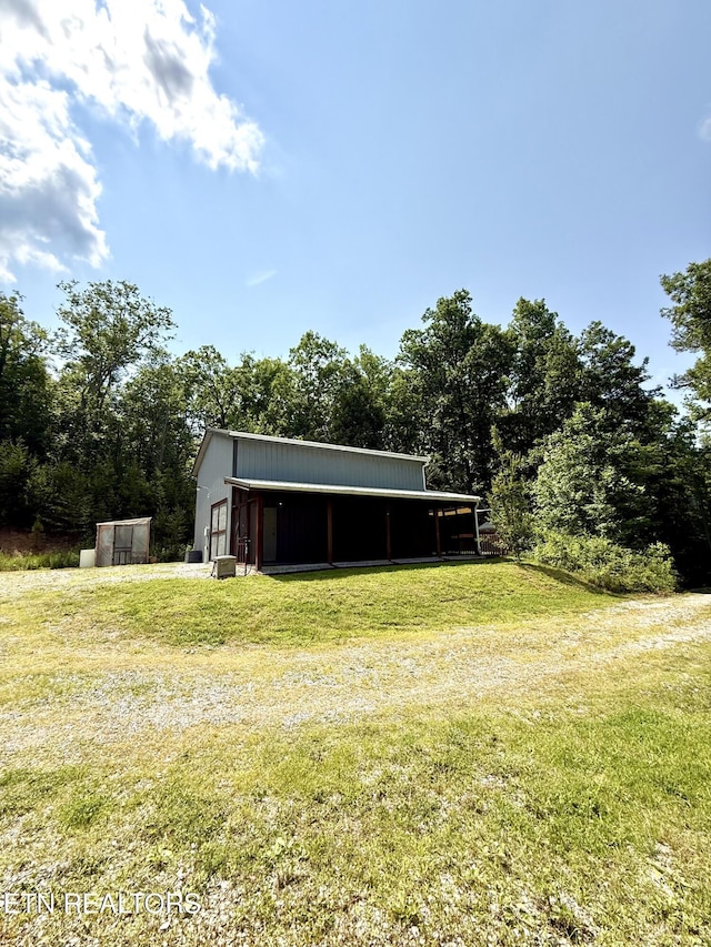 179 Wiggins Rd, Tellico Plains, TN 37385 - view of pole building with a lawn