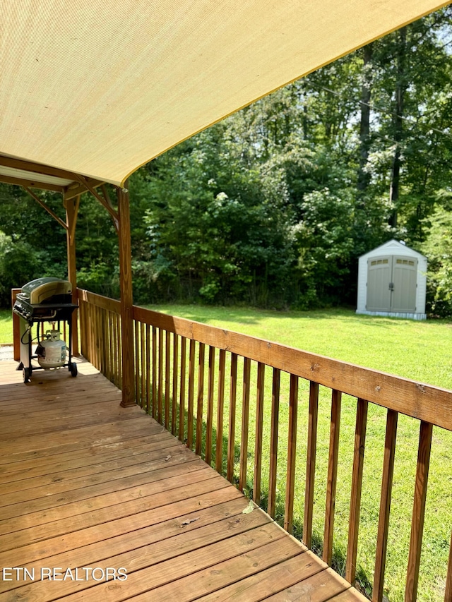 179 Wiggins Rd, Tellico Plains, TN 37385 - wooden terrace featuring area for grilling, a yard, and view of wooded area