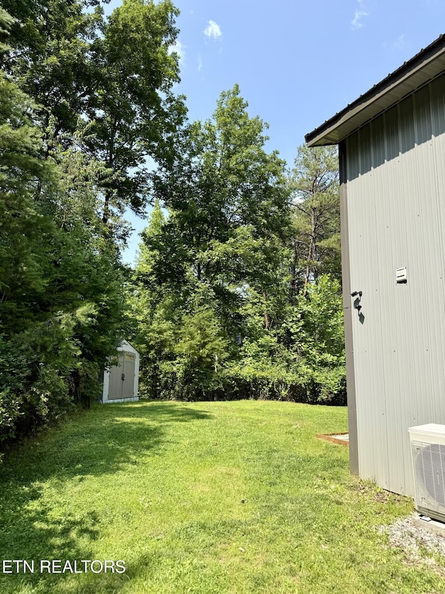 179 Wiggins Rd, Tellico Plains, TN 37385 - view of green lawn with ac unit