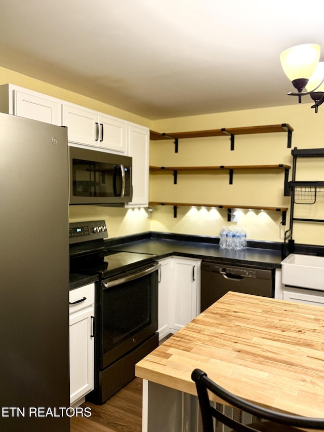 179 Wiggins Rd, Tellico Plains, TN 37385 - kitchen featuring appliances with stainless steel finishes, open shelves, wooden counters, white cabinets, and dark wood-type flooring