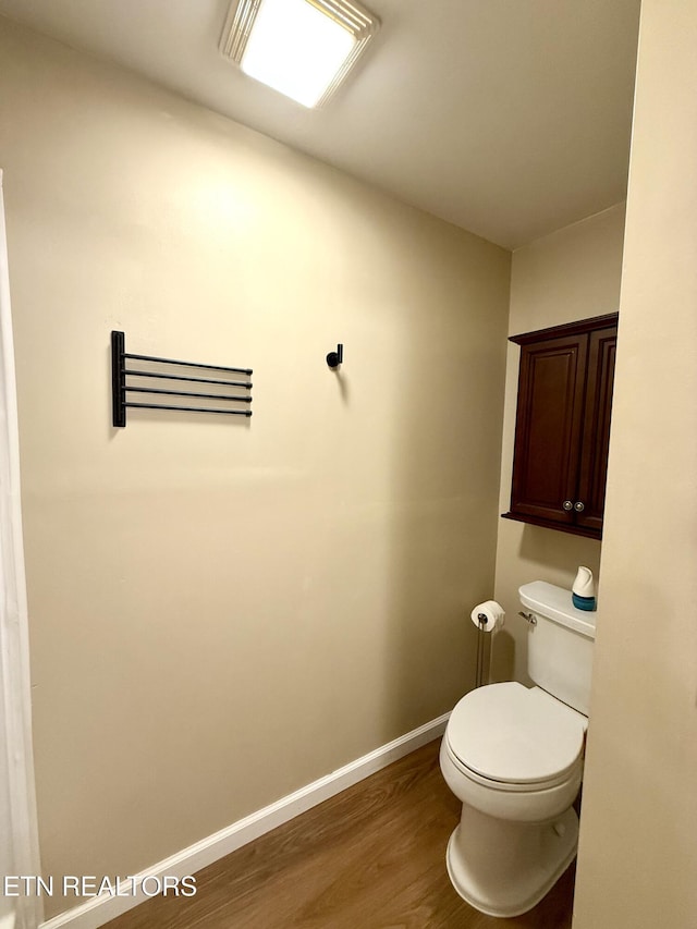 179 Wiggins Rd, Tellico Plains, TN 37385 - bathroom featuring wood finished floors, toilet, and baseboards