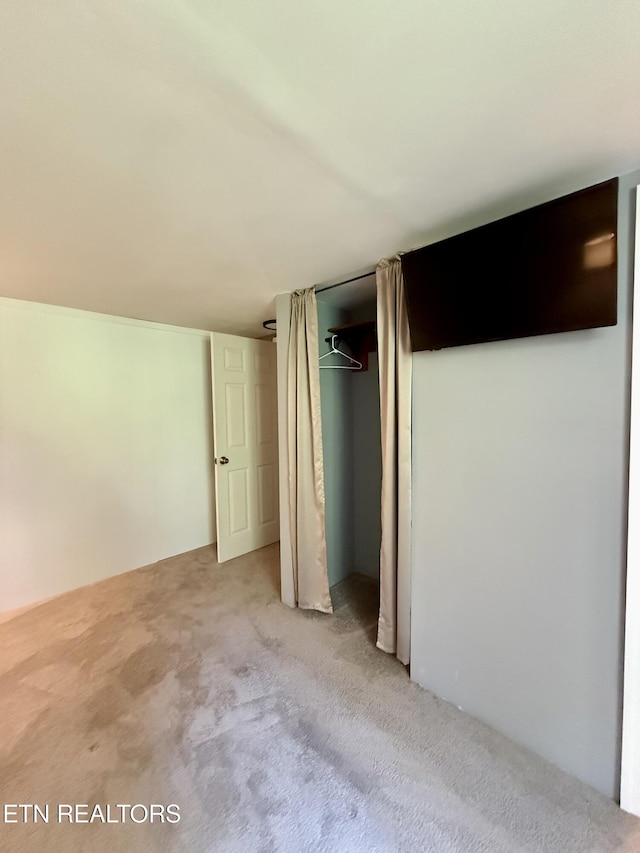 179 Wiggins Rd, Tellico Plains, TN 37385 - unfurnished bedroom featuring light colored carpet and a closet