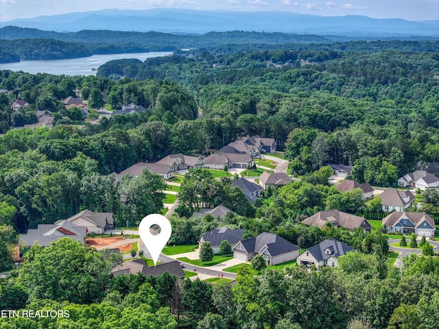 126 Pocola Way, Loudon, TN 37774 - aerial view of residential area featuring a heavily wooded area and a water and mountain view
