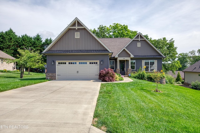 126 Pocola Way, Loudon, TN 37774 - craftsman house with board and batten siding, an attached garage, driveway, a front yard, and a shingled roof