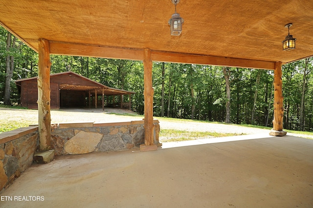 495 Bear Hollow Rd, Oneida, TN 37841 - view of patio / terrace with an outbuilding and a forest view
