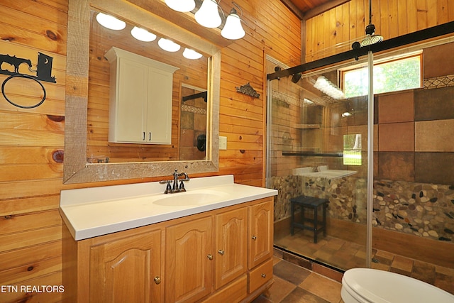 495 Bear Hollow Rd, Oneida, TN 37841 - bathroom with wooden walls, vanity, a stall shower, toilet, and stone finish flooring