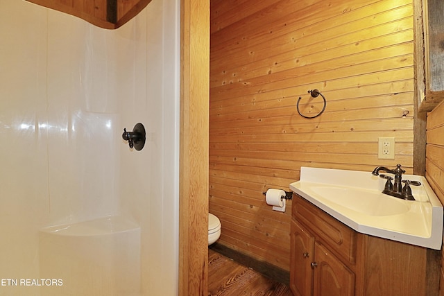 495 Bear Hollow Rd, Oneida, TN 37841 - bathroom with vanity, toilet, a shower, wooden walls, and wood finished floors