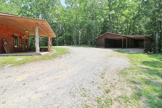 495 Bear Hollow Rd, Oneida, TN 37841 - view of dirt / gravel road featuring a view of trees and a pole building