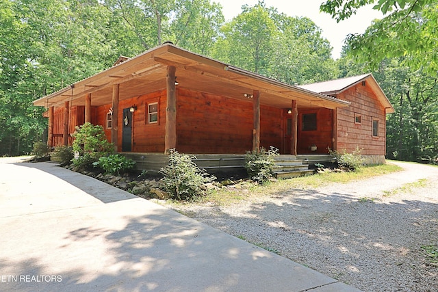 495 Bear Hollow Rd, Oneida, TN 37841 - view of front facade with a porch, driveway, and metal roof