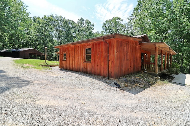 495 Bear Hollow Rd, Oneida, TN 37841 - view of property exterior with board and batten siding and driveway