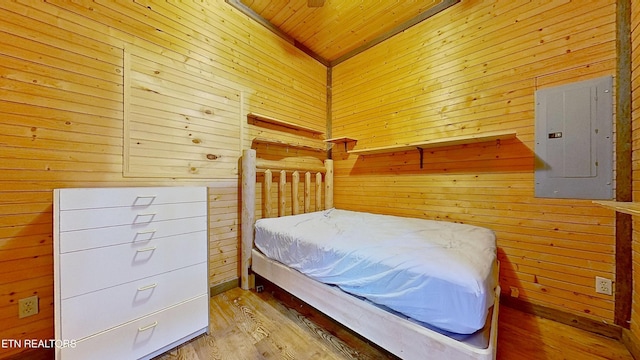 495 Bear Hollow Rd, Oneida, TN 37841 - bedroom featuring electric panel, wood walls, wooden ceiling, and wood finished floors