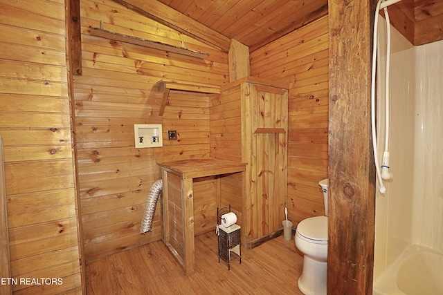 495 Bear Hollow Rd, Oneida, TN 37841 - bathroom with toilet, wood walls, wood finished floors, wooden ceiling, and a bath