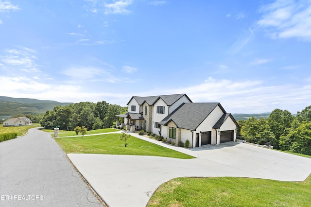 888 Smokey Quartz Blvd, New Tazewell, TN 37825 - modern inspired farmhouse featuring a front lawn, a garage, driveway, and a mountain view