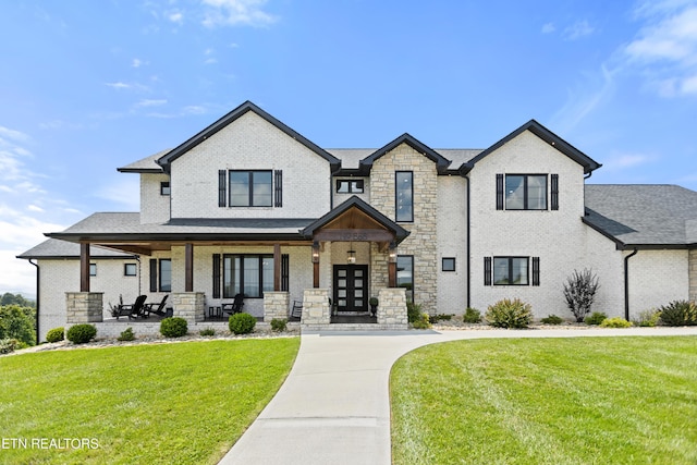 888 Smokey Quartz Blvd, New Tazewell, TN 37825 - view of front facade with a front lawn, a porch, brick siding, and stone siding