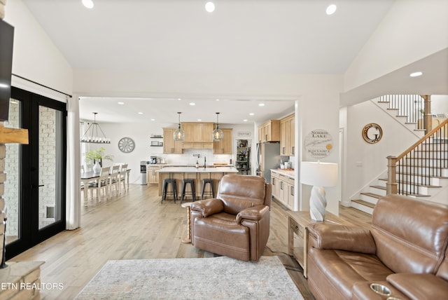 888 Smokey Quartz Blvd, New Tazewell, TN 37825 - living area featuring light wood-type flooring, stairs, recessed lighting, and vaulted ceiling