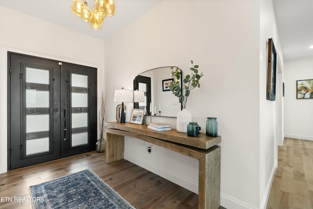 888 Smokey Quartz Blvd, New Tazewell, TN 37825 - entrance foyer with wood finished floors, baseboards, french doors, a chandelier, and arched walkways