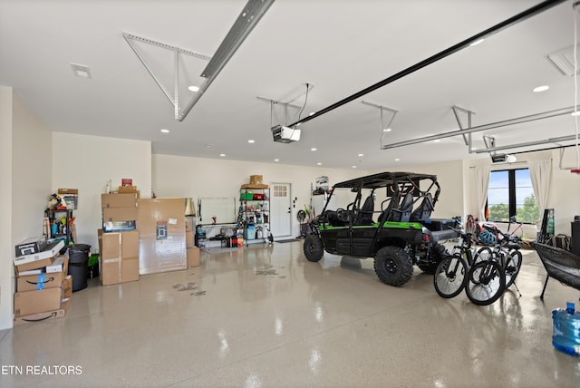 888 Smokey Quartz Blvd, New Tazewell, TN 37825 - garage featuring a garage door opener and recessed lighting