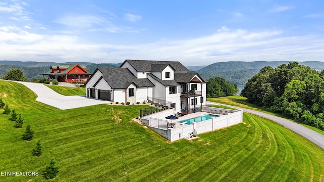888 Smokey Quartz Blvd, New Tazewell, TN 37825 - back of house featuring a balcony, concrete driveway, a mountain view, and stone siding