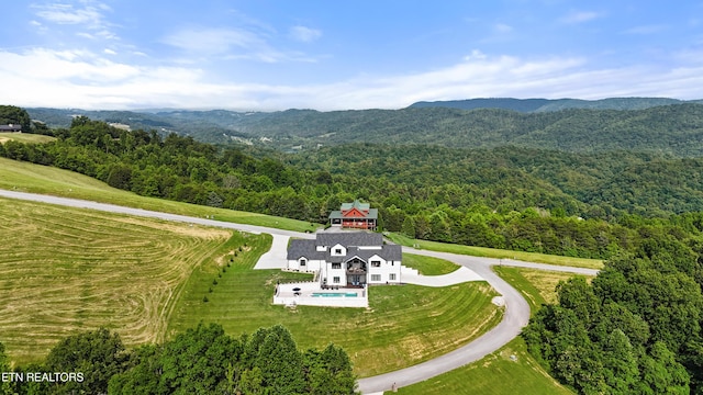 888 Smokey Quartz Blvd, New Tazewell, TN 37825 - view from above of property with a heavily wooded area and a mountain backdrop