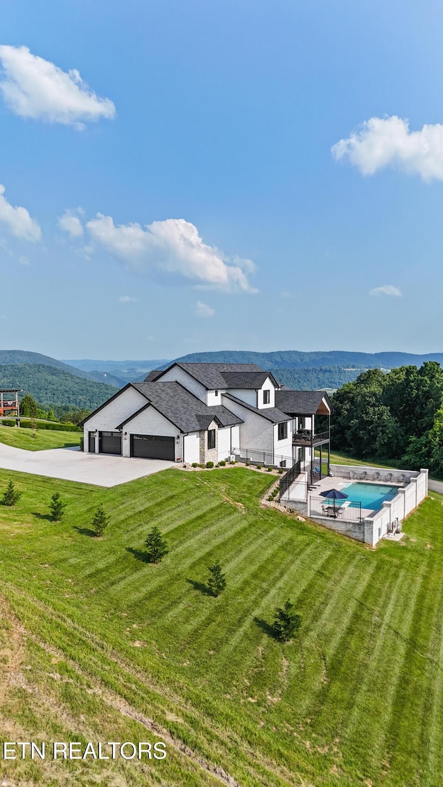 888 Smokey Quartz Blvd, New Tazewell, TN 37825 - exterior space with an attached garage, a mountain view, and driveway