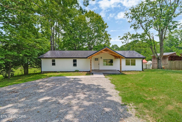 1095 Franklin Rd, Jamestown, TN 38556 - modern inspired farmhouse featuring gravel driveway and metal roof