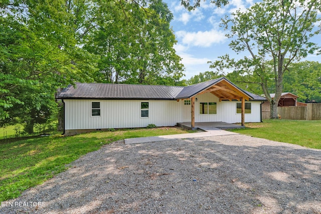 1095 Franklin Rd, Jamestown, TN 38556 - modern farmhouse with metal roof and driveway