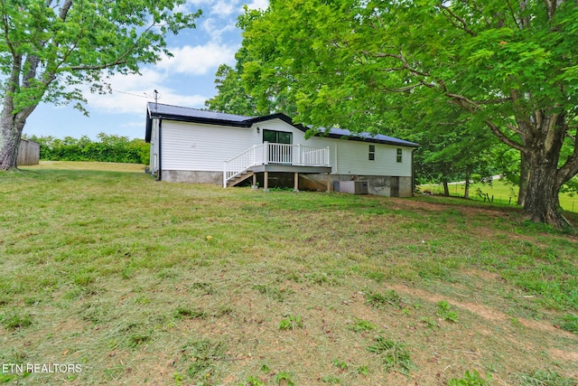 1095 Franklin Rd, Jamestown, TN 38556 - rear view of house featuring central AC unit, a lawn, a deck, and stairway