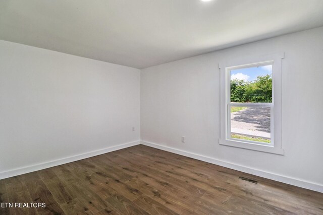 1095 Franklin Rd, Jamestown, TN 38556 - spare room featuring dark wood-style floors and baseboards