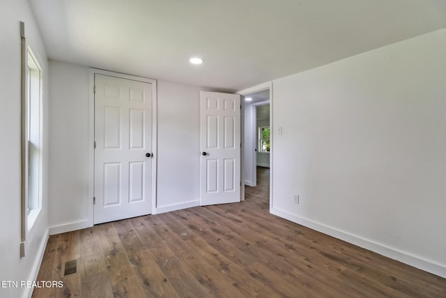 1095 Franklin Rd, Jamestown, TN 38556 - unfurnished bedroom with wood finished floors, baseboards, and recessed lighting