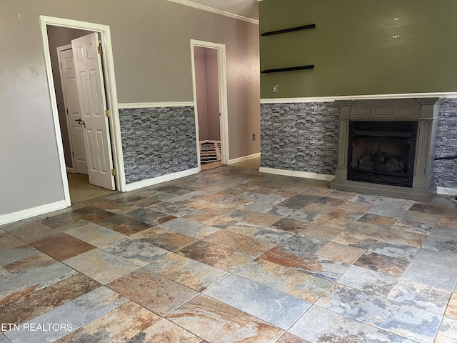159 Emory Ln, Tazewell, TN 37879 - unfurnished living room with stone tile flooring, baseboards, ornamental molding, and a fireplace