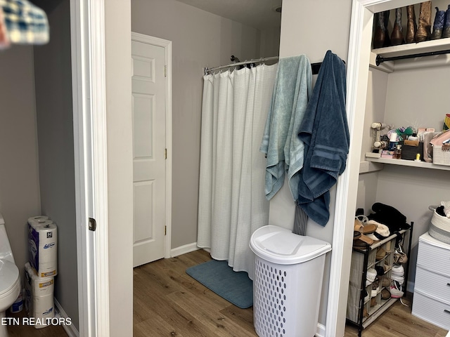 306 E Tri County Blvd, Oliver Springs, TN 37840 - bathroom featuring wood finished floors and curtained shower