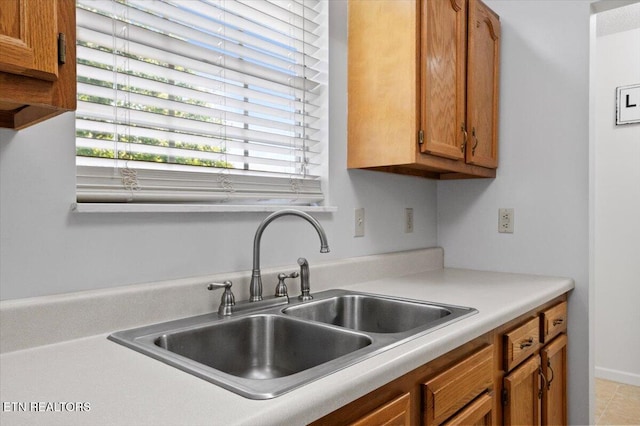 340 Mountain View Ests, Caryville, TN 37714 - kitchen featuring a sink, brown cabinets, and light countertops