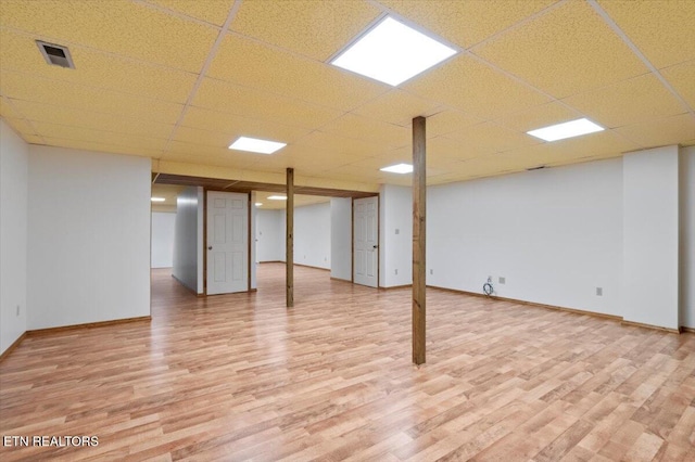 340 Mountain View Ests, Caryville, TN 37714 - finished below grade area featuring light wood-type flooring, baseboards, and a drop ceiling
