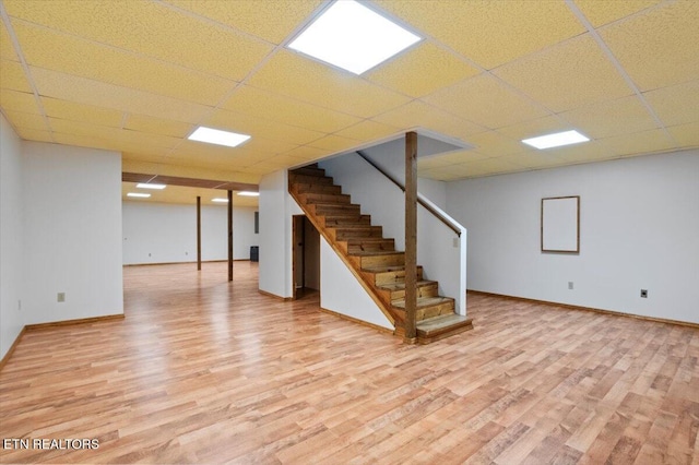 340 Mountain View Ests, Caryville, TN 37714 - finished basement featuring light wood finished floors, stairway, baseboards, and a paneled ceiling