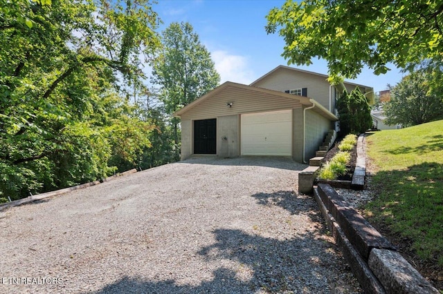 340 Mountain View Ests, Caryville, TN 37714 - view of home's exterior with gravel driveway and a garage